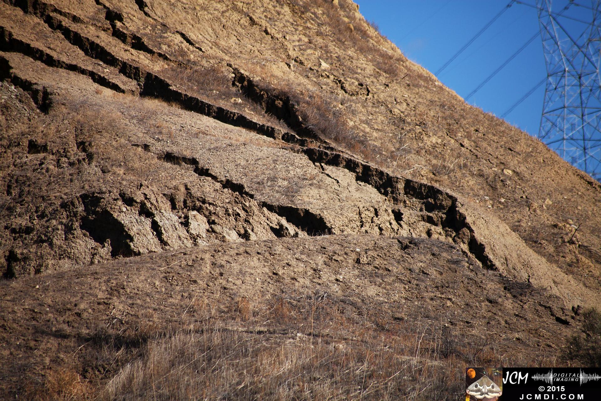Landslide, buckled pavement, and terrain at Vasquez Canyon Road in Santa Clarita, CA filmed 11-25-2015